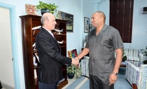 Tourism Minister, Richard Sealy (right) greeting Qatar's Ambassador to Barbados, Battal M. Al-Dosari at a recent courtesy call at the Ministry of Tourism. (C.Pitt/BGIS)
