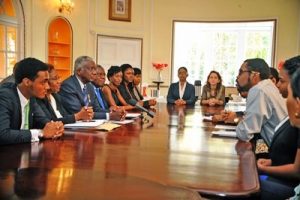 Prime Minister Freundel Stuart (left centre) listens attentively to students during a meeting at Ilaro Court recently. (A.Miller/BGIS)