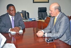 International Business Minister, Donville Inniss chatting with Qatar's Ambassador to Barbados, Battal Maejeb al Dosari during their meeting at Reef Road. (A.Miller/BGIS)